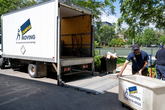 A moving crew loading a truck at a residential job